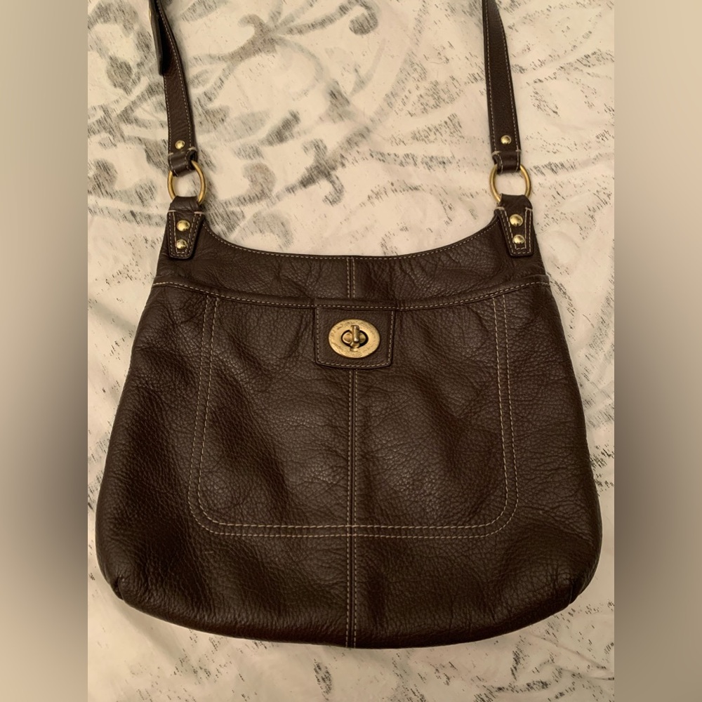 Coach purse in gorgeous brown leather. Gently used condition. Variety of pockets